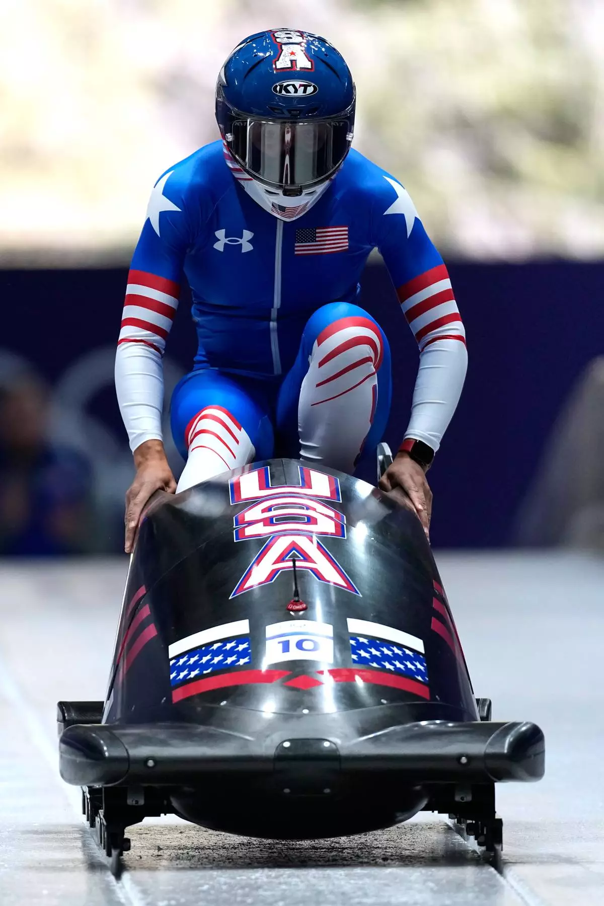 United States' Elana Meyers Taylor starts for a women's monobob run at the 2026 Winter Olympics, in Cortina d'Ampezzo, Italy, Sunday, Feb. 15, 2026. (AP Photo/Aijaz Rahi)