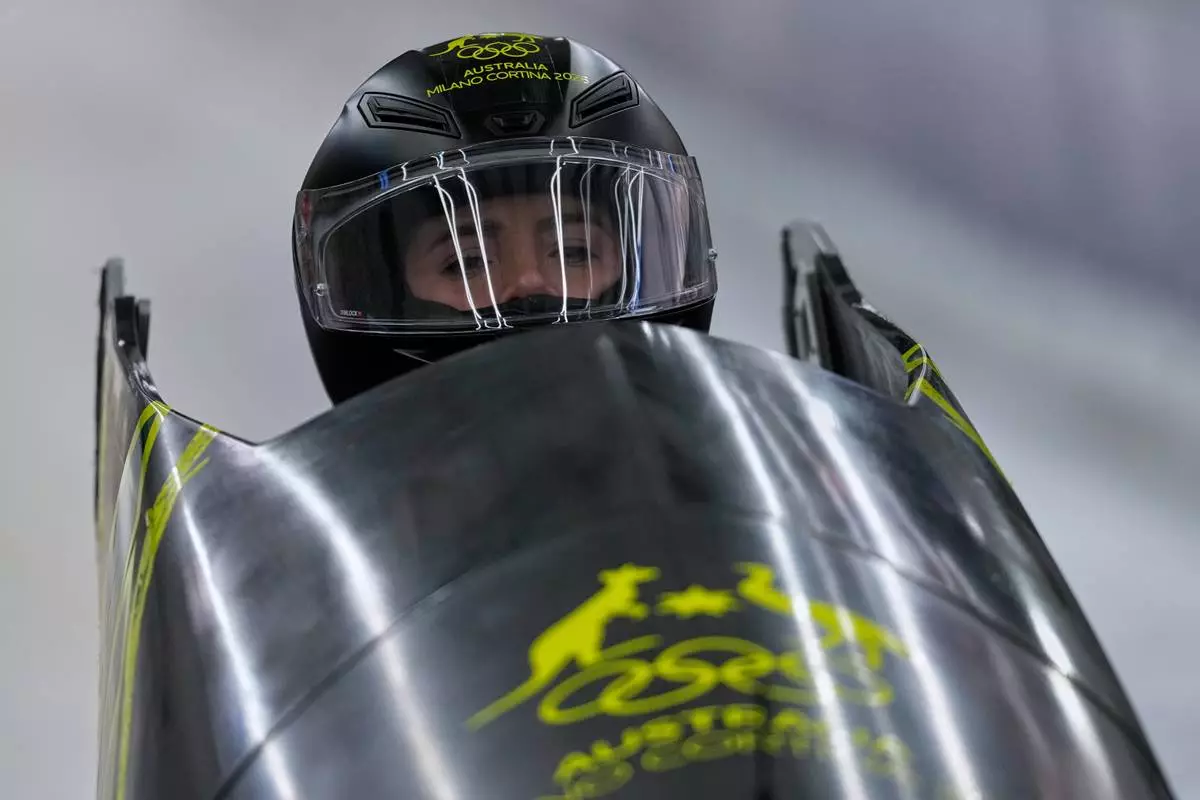 Australia's Bree Walker starts for a women's monobob run at the 2026 Winter Olympics, in Cortina d'Ampezzo, Italy, Sunday, Feb. 15, 2026. (AP Photo/Aijaz Rahi)