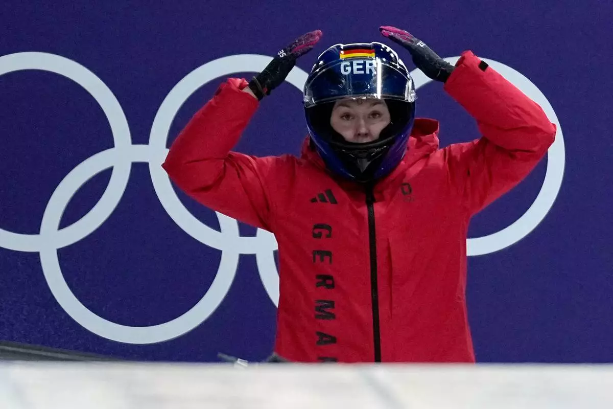 Germany's Laura Nolte prepares to start for a women's monobob run at the 2026 Winter Olympics, in Cortina d'Ampezzo, Italy, Sunday, Feb. 15, 2026. (AP Photo/Aijaz Rahi)