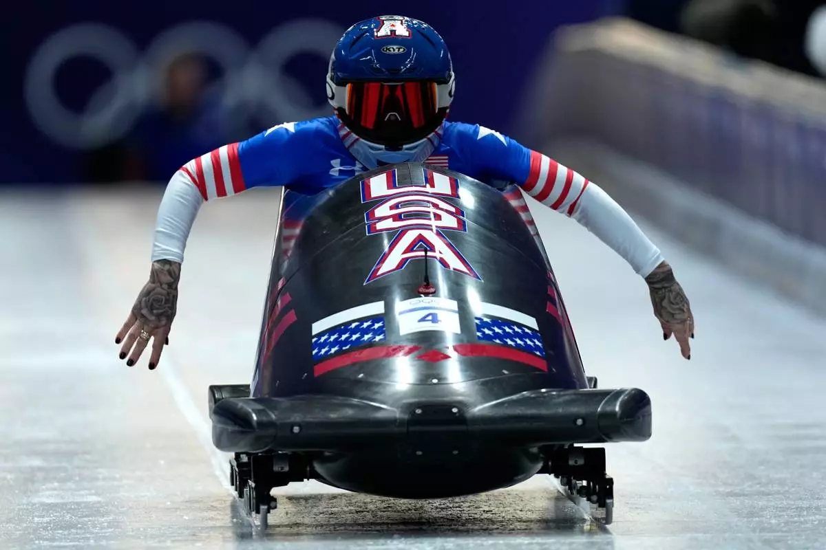 United States' Kaillie Armbruster Humphries starts for a women's monobob run at the 2026 Winter Olympics, in Cortina d'Ampezzo, Italy, Sunday, Feb. 15, 2026. (AP Photo/Aijaz Rahi)