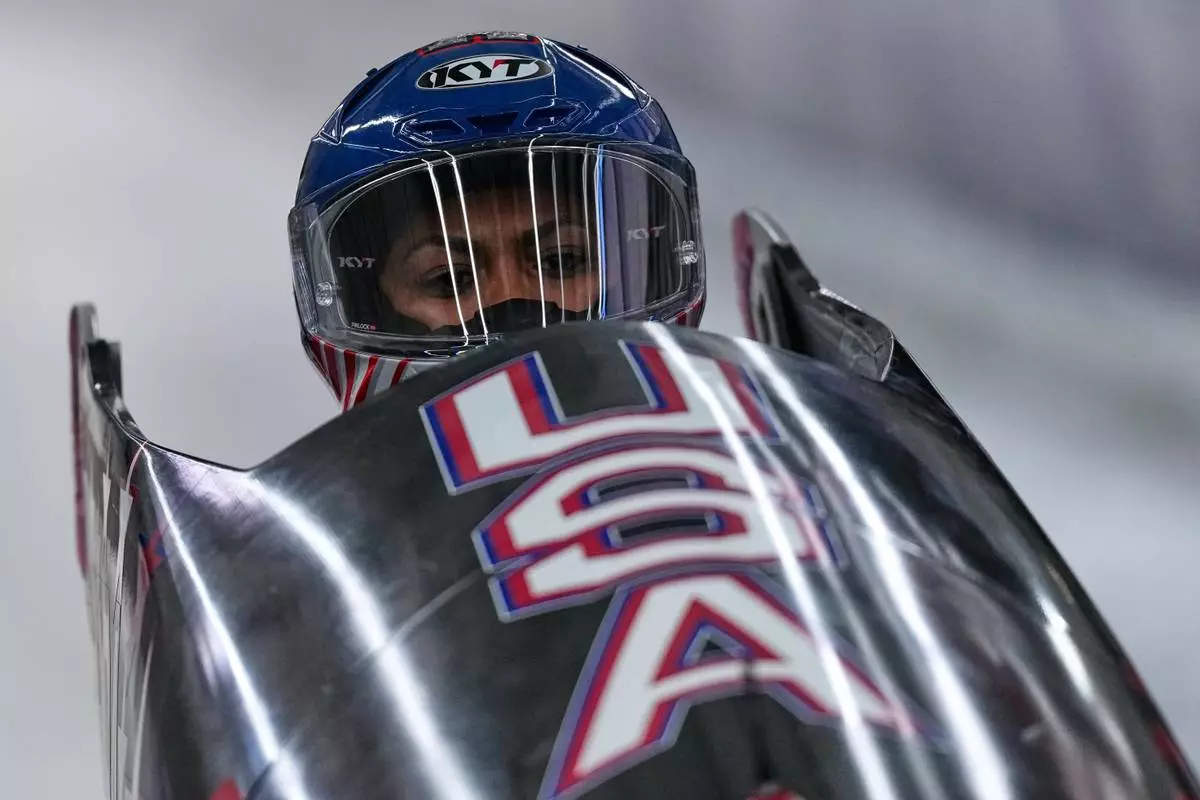 United States' Kaysha Love starts for a women's monobob run at the 2026 Winter Olympics, in Cortina d'Ampezzo, Italy, Sunday, Feb. 15, 2026. (AP Photo/Aijaz Rahi)