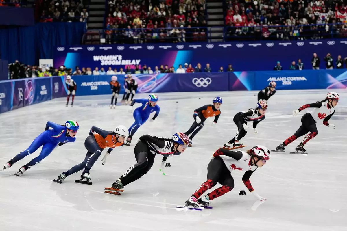 Team Italy, Team Netherlands, Team Korea and Team Canada compete during the short track speed skating women's team 3000m relay at the 2026 Winter Olympics, in Milan, Italy, Wednesday, Feb. 18, 2026. (AP Photo/Ashley Landis)