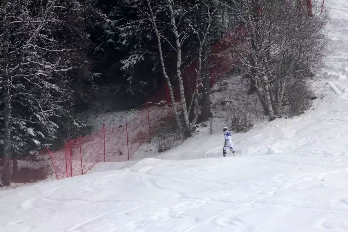 Norway's Atle Lie McGrath walks off the course after skiing out during an alpine ski, men's slalom race, at the 2026 Winter Olympics, in Bormio, Italy, Monday, Feb. 16, 2026. (AP Photo/John Locher)