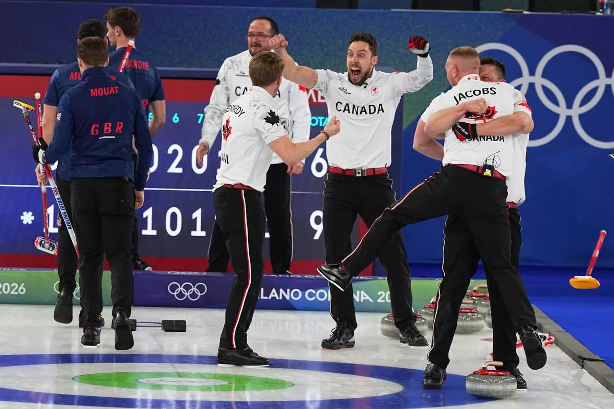 Canada's Brett Gallant, Brad Jacobs, Marc Kennedy and Ben Hebert celebrate defeating Britain in a men's curling gold medal match, at the 2026 Winter Olympics, in Cortina d'Ampezzo, Italy, Saturday, Feb. 21, 2026. (AP Photo/Fatima Shbair)