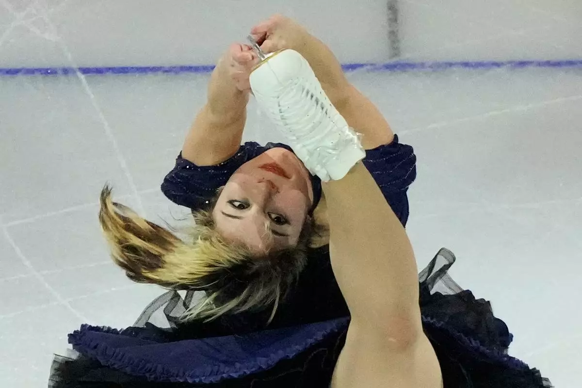 Alysa Liu of the United States performs during an exhibition gala at the 2026 Winter Olympics, in Milan, Italy, Saturday, Feb. 21, 2026. (AP Photo/Christophe Ena)