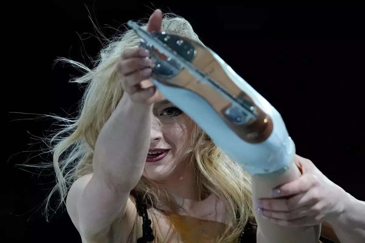 Amber Glenn of the United States performs during the figure skating exhibition at the 2026 Winter Olympics, in Milan, Italy, Saturday, Feb. 21, 2026. (AP Photo/Ashley Landis)