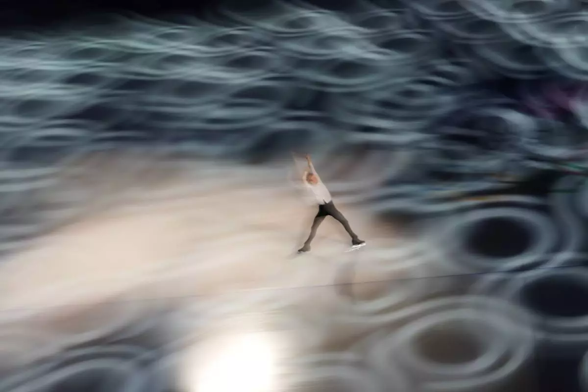 Daniel Grassl of Italy performs during the figure skating exhibition at the 2026 Winter Olympics, in Milan, Italy, Saturday, Feb. 21, 2026. (AP Photo/Francisco Seco)