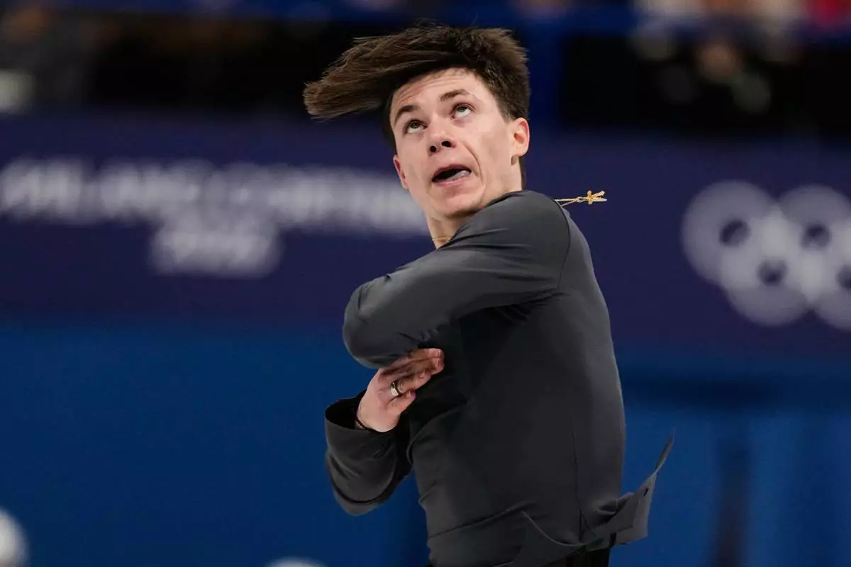 Maxim Naumov of the United States competes during the men's free skate program in figure skating at the 2026 Winter Olympics, in Milan, Italy, Friday, Feb. 13, 2026. (AP Photo/Ashley Landis)