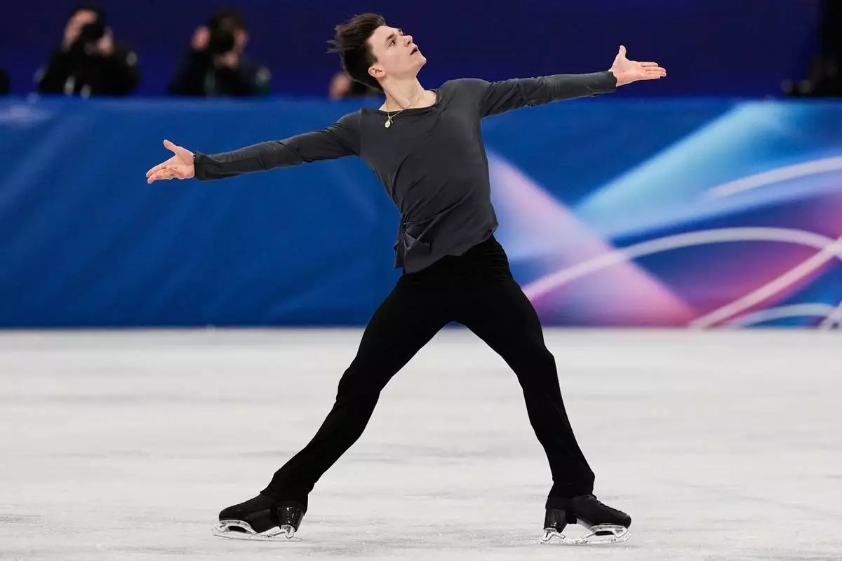 Maxim Naumov of the United States competes during the men's free skate program in figure skating at the 2026 Winter Olympics, in Milan, Italy, Friday, Feb. 13, 2026. (AP Photo/Ashley Landis)