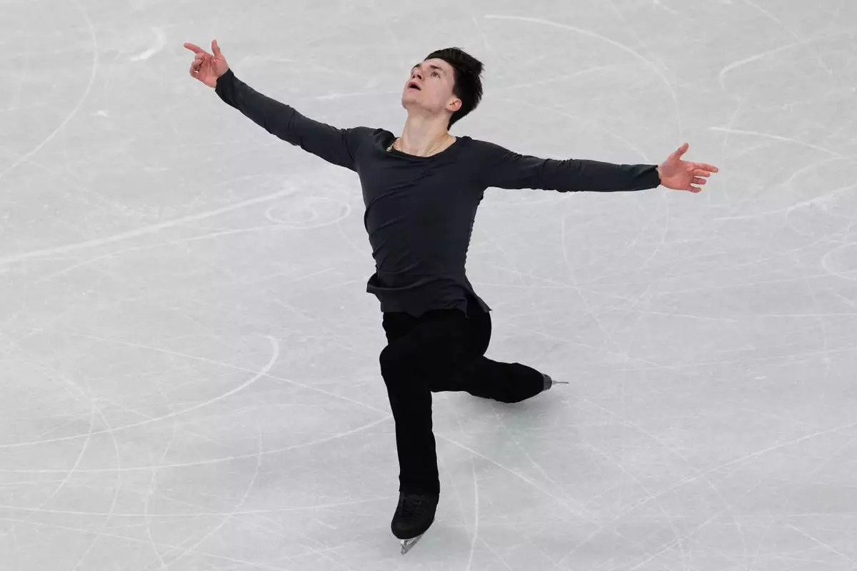 Maxim Naumov of the United States competes during the men's free skate program in figure skating at the 2026 Winter Olympics, in Milan, Italy, Friday, Feb. 13, 2026. (AP Photo/Francisco Seco)