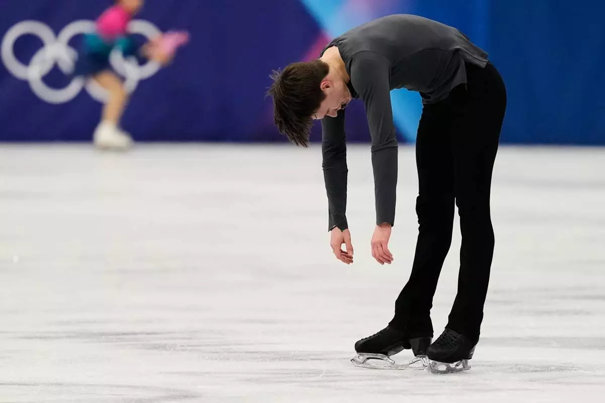 Maxim Naumov of the United States competes during the men's free skate program in figure skating at the 2026 Winter Olympics, in Milan, Italy, Friday, Feb. 13, 2026. (AP Photo/Ashley Landis)