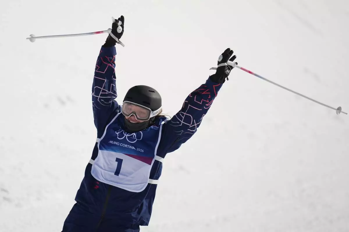 Britain's Zoe Atkin celebrates during the women's freestyle skiing halfpipe final at the 2026 Winter Olympics, in Livigno, Italy, Sunday, Feb. 22, 2026. (AP Photo/Abbie Parr)