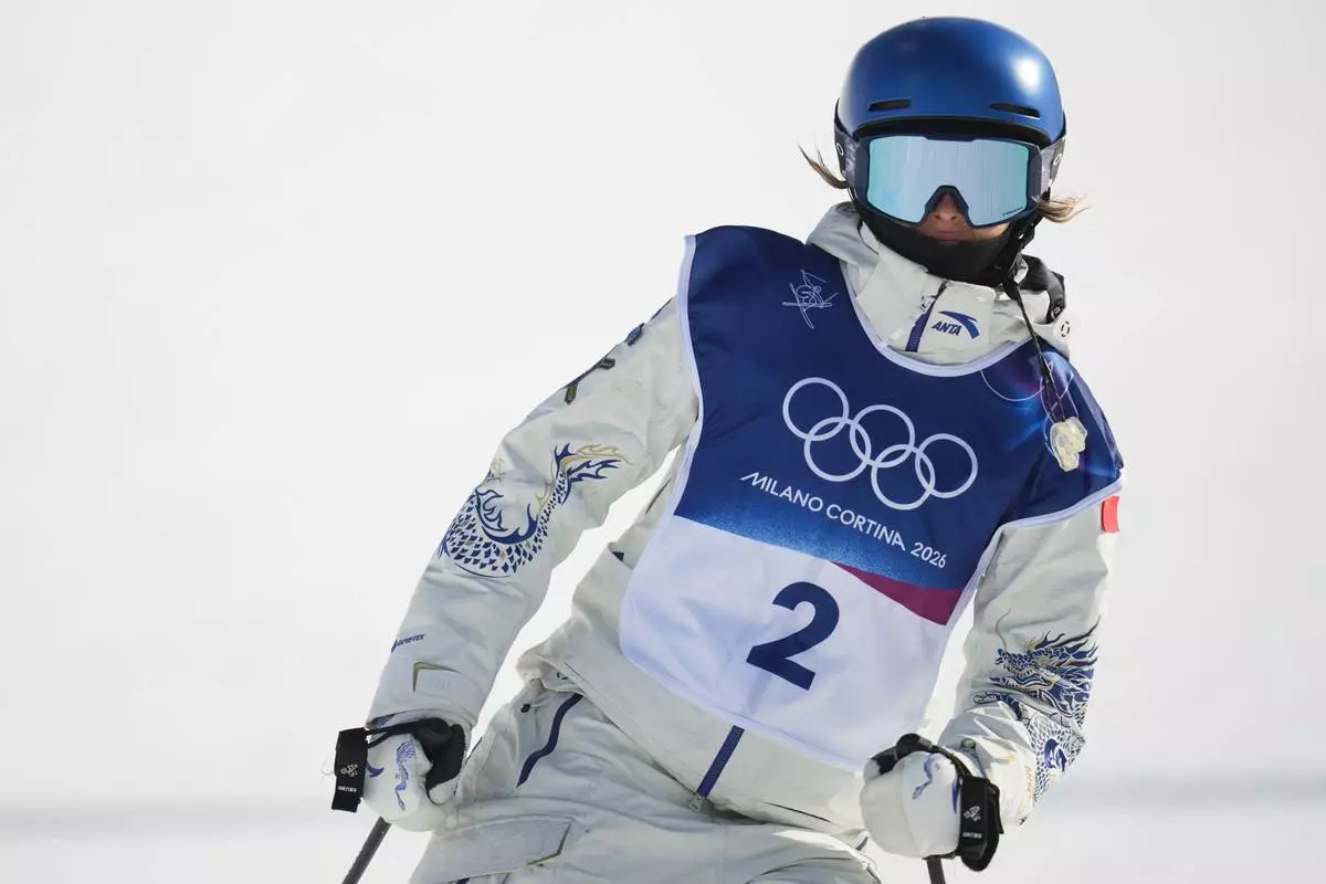 China's Eileen Gu reacts during the women's freestyle skiing halfpipe final at the 2026 Winter Olympics, in Livigno, Italy, Sunday, Feb. 22, 2026. (AP Photo/Abbie Parr)