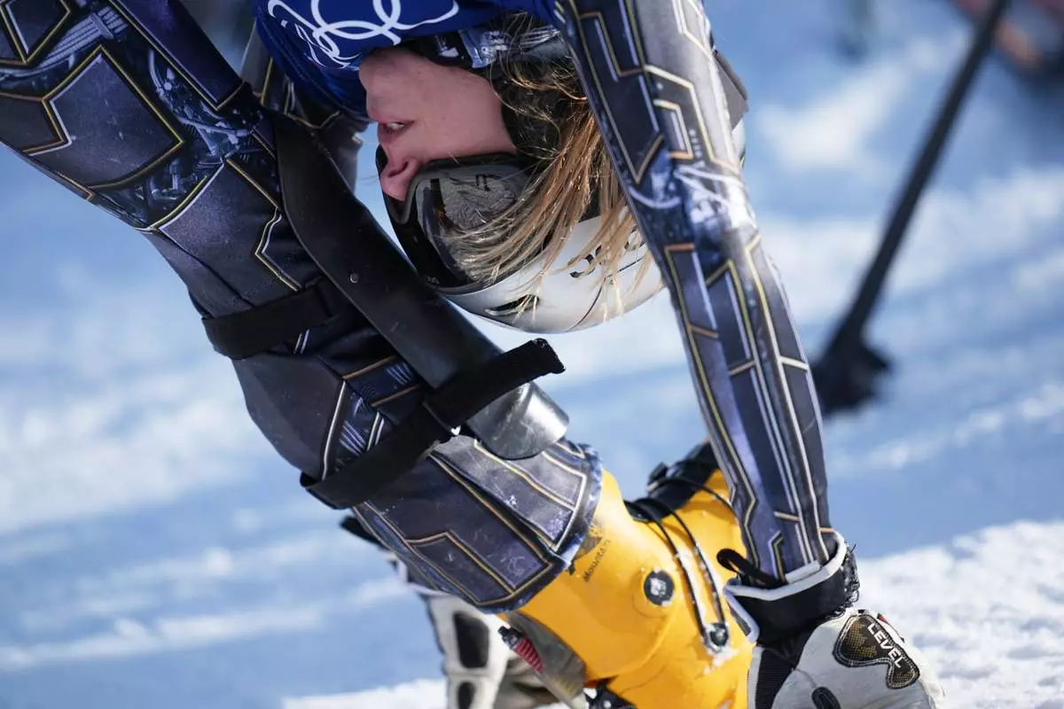 Czechia's Ester Ledecka warms up during the women's snowboarding parallel giant slalom finals at the 2026 Winter Olympics, in Livigno, Italy, Sunday, Feb. 8, 2026. (AP Photo/Gregory Bull)