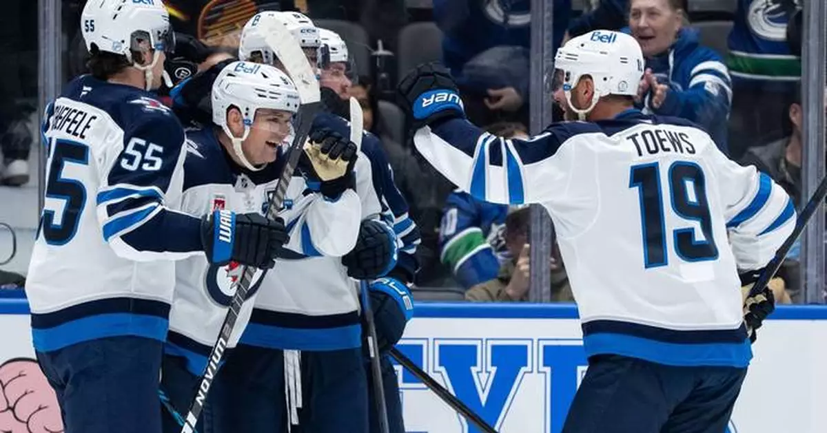 Cole Perfetti scores in overtime in the Jets' 3-2 victory over the Canucks