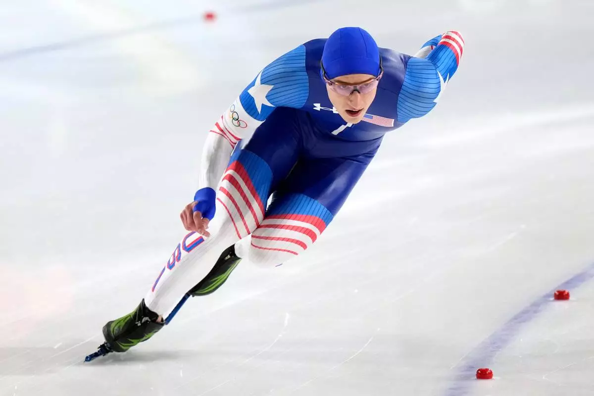 Jordan Stolz of the U.S. competes in the men's 500 meters speedskating race at the 2026 Winter Olympics, in Milan, Italy, Saturday, Feb. 14, 2026. (AP Photo/Luca Bruno)