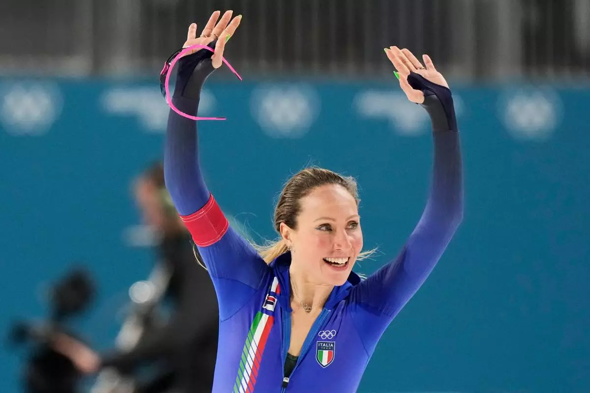 Francesca Lollobrigida of Italy celebrates after competing in the women's 3,000 meters speedskating race at the 2026 Winter Olympics, in Milan, Italy, Saturday, Feb. 7, 2026. (AP Photo/Luca Bruno)