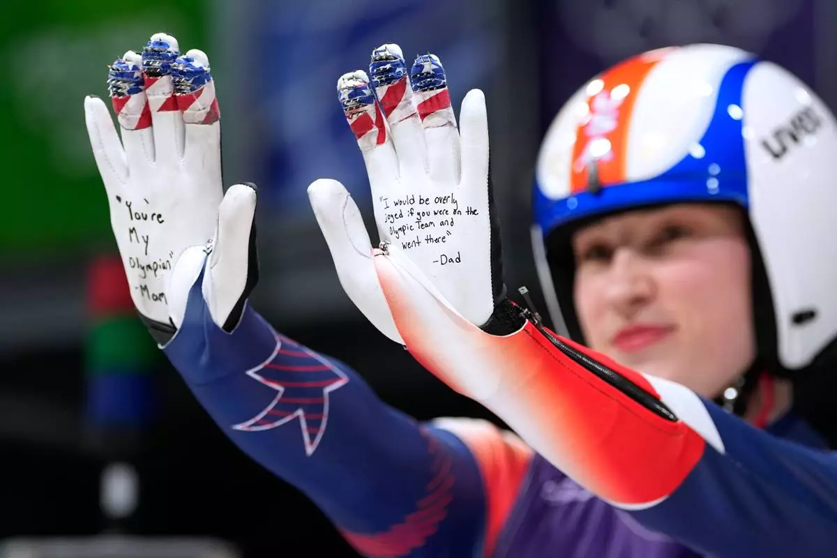 United States' Sophia Kirkby poses during the luge relay competition at the 2026 Winter Olympics, in Cortina d'Ampezzo, Italy, Thursday, Feb. 12, 2026. (AP Photo/Alessandra Tarantino)