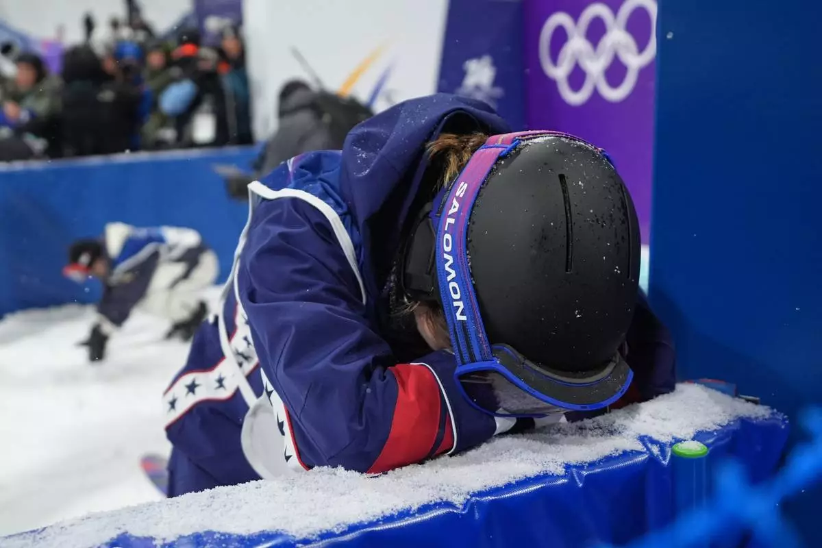 United States' Maddie Mastro reacts after her run during the women's snowboarding halfpipe finals at the 2026 Winter Olympics, in Livigno, Italy, Thursday, Feb. 12, 2026. (AP Photo/Lindsey Wasson)
