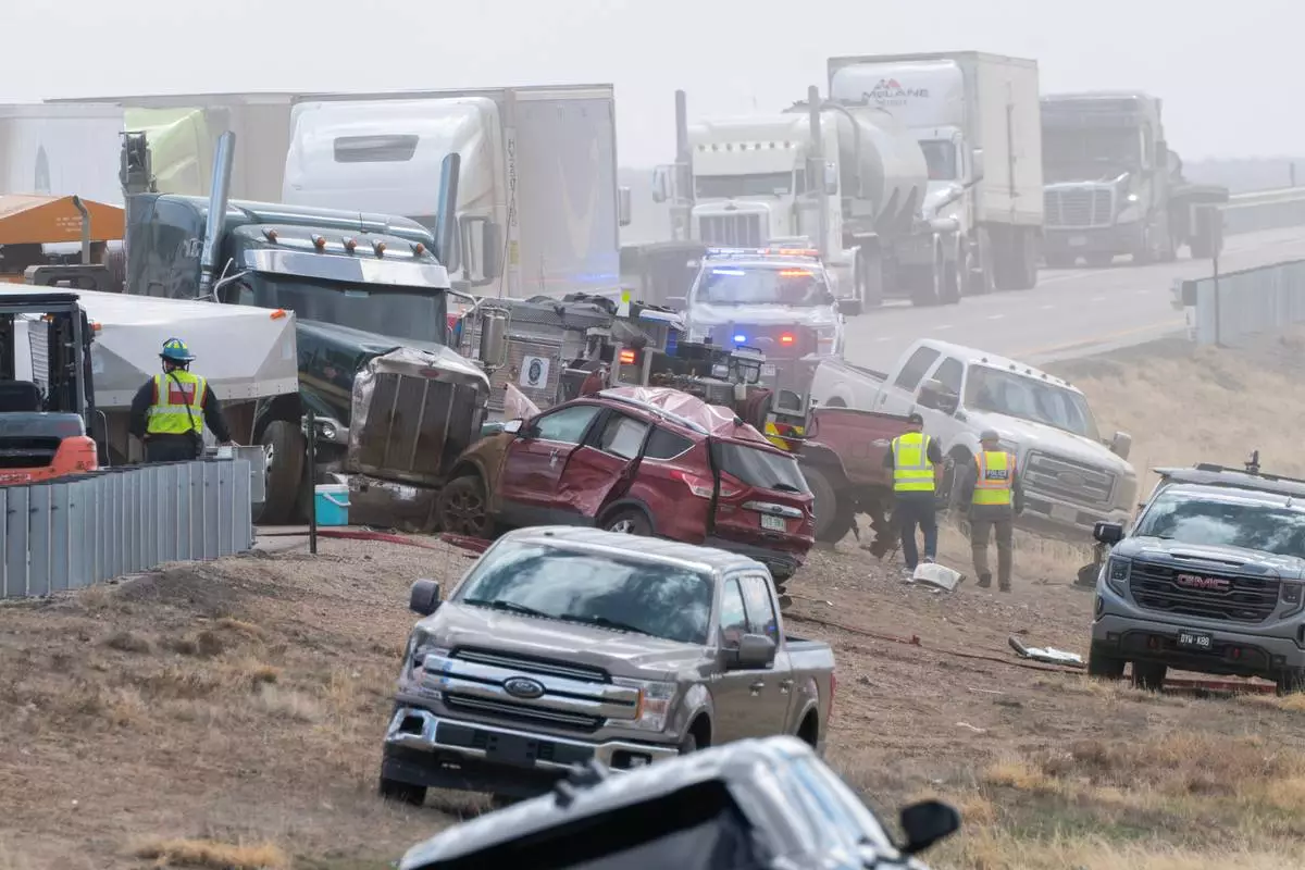 Emergency personnel work the scene of a crash involving 30-plus vehicles including six semi trucks on Interstate 25 south of Pueblo, Colo., on Tuesday, Feb. 17, 2026. (Christian Murdock/The Gazette via AP)