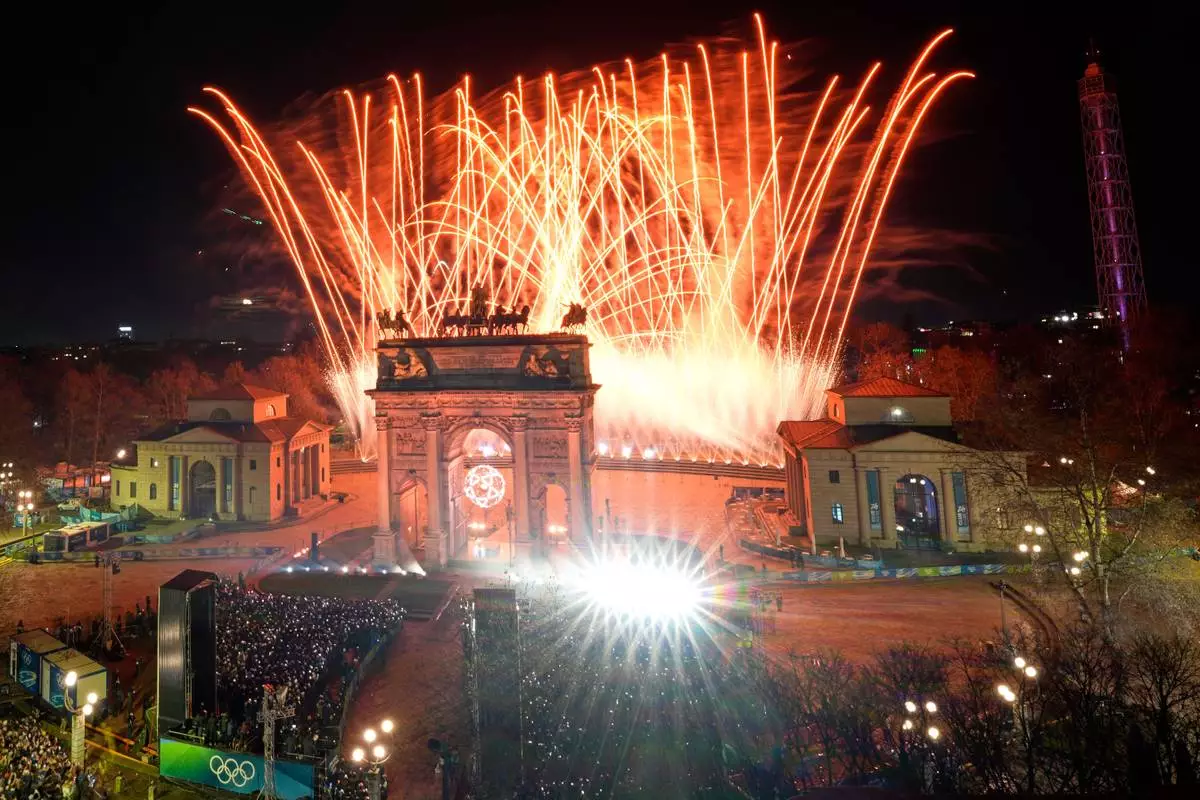 Fireworks illuminate the sky after Italian former skier Deborah Compagnoni and Italian former skier Alberto Tomba lit the cauldron at the Arco della Pace during the Olympic opening ceremony at the 2026 Winter Olympics, in Milan, Italy, Friday, Feb. 6, 2026. (AP Photo/Luca Bruno)
