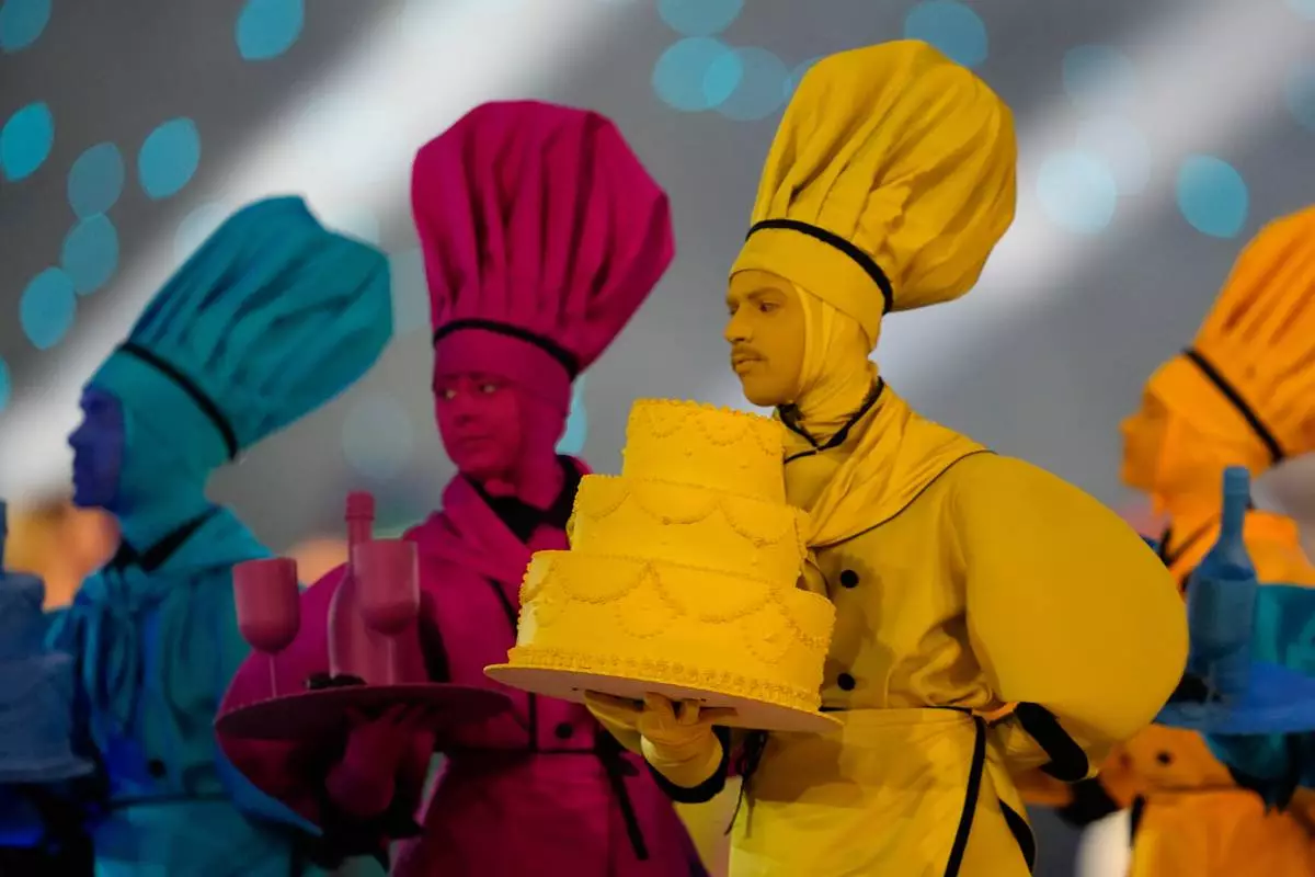 Dancers perform during the Olympic opening ceremony at the 2026 Winter Olympics, in Milan, Italy, Friday, Feb. 6, 2026. (AP Photo/Ashley Landis)