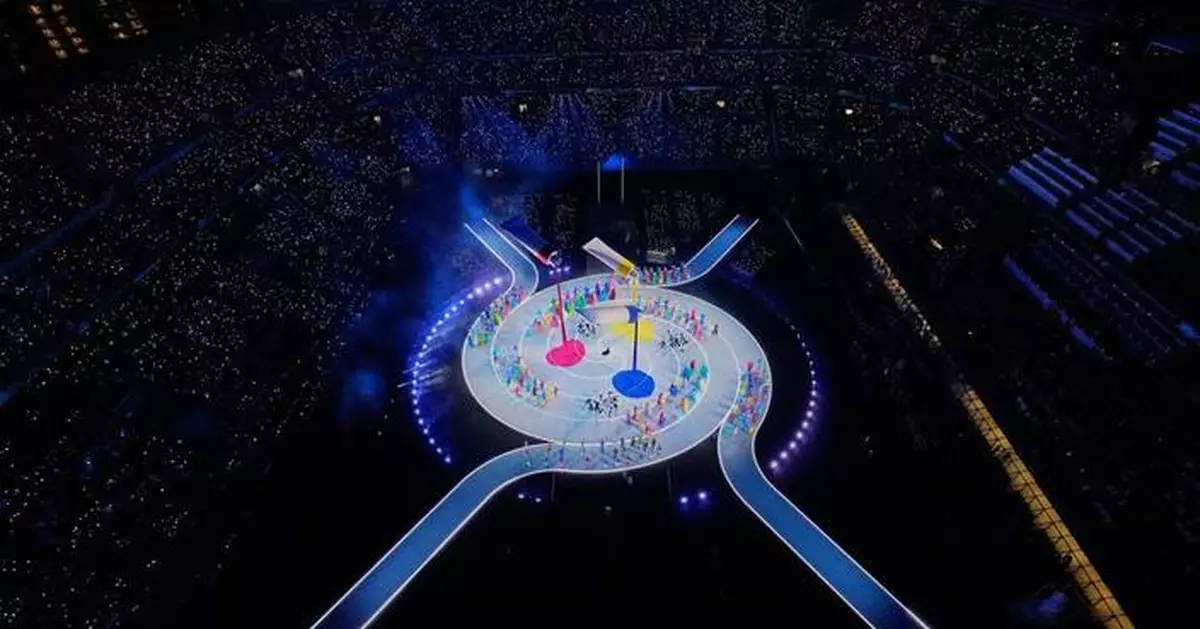 The Latest: Two cauldrons are lit for the first time at a Winter Olympics