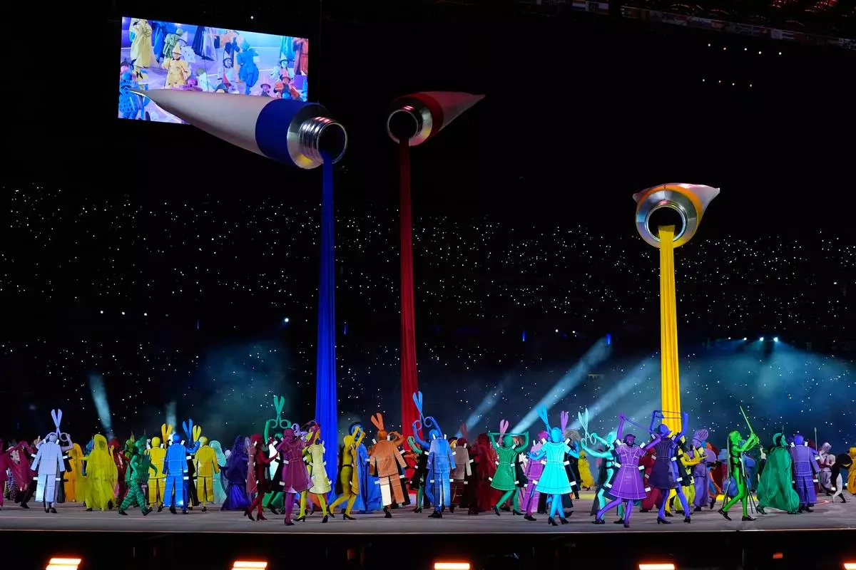 Dancers perform during the Olympic opening ceremony at the 2026 Winter Olympics, in Milan, Italy, Friday, Feb. 6, 2026. (AP Photo/Ashley Landis)