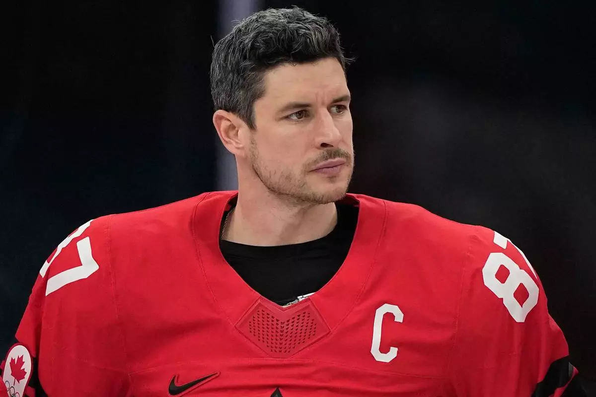 Canada's Sidney Crosby (87) reacts after Canada lost to the United States in a men's ice hockey gold medal game between Canada and the United States at the 2026 Winter Olympics, in Milan, Italy, Sunday, Feb. 22, 2026. (AP Photo/Petr David Josek)