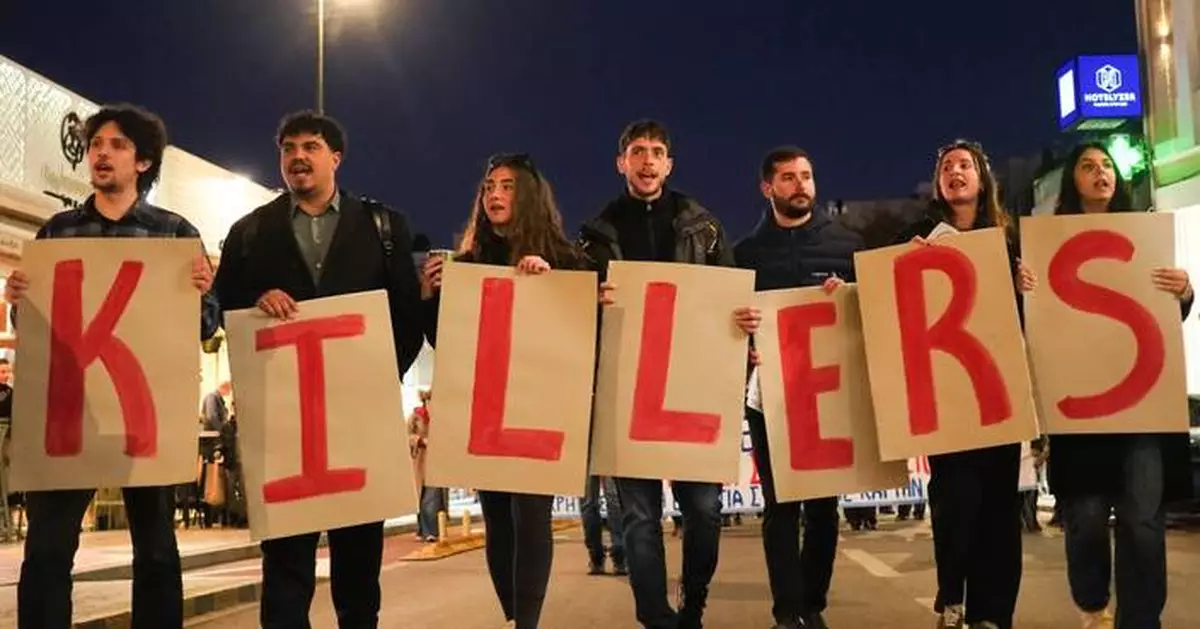 Protest held on Greek island against docked US aircraft carrier as Iran tension builds