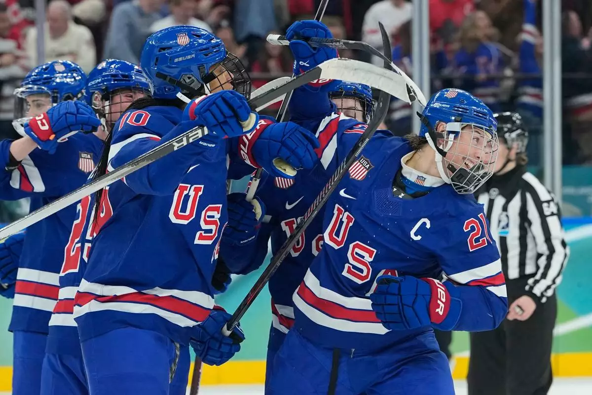 United States' Hilary Knight (21) celebrates after scoring an equalizer during a women's ice hockey gold medal game between the United States and Canada at the 2026 Winter Olympics, in Milan, Italy, Thursday, Feb. 19, 2026. (AP Photo/Petr David Josek)