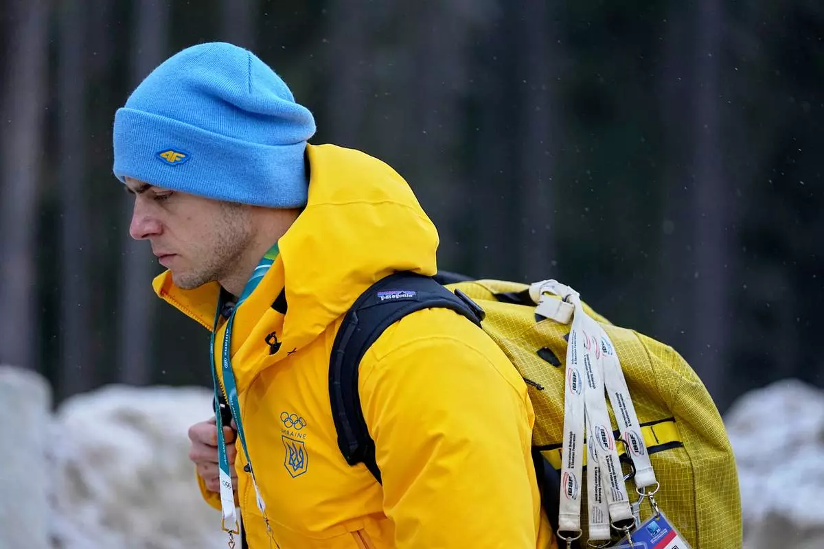 Ukrainian skeleton athlete Vladyslav Heraskevych walks next to the start house of the sliding center at the 2026 Winter Olympics, in Cortina d'Ampezzo, Italy, Thursday, Feb. 12, 2026. (AP Photo/Fatima Shbair)