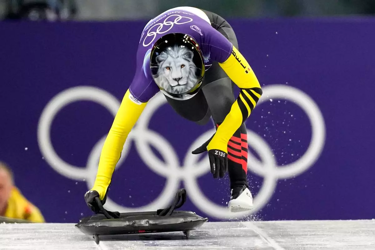 Belgium's Kim Meylemans starts for a women's skeleton run at the 2026 Winter Olympics, in Cortina d'Ampezzo, Italy, Friday, Feb. 13, 2026. (AP Photo/Aijaz Rahi)