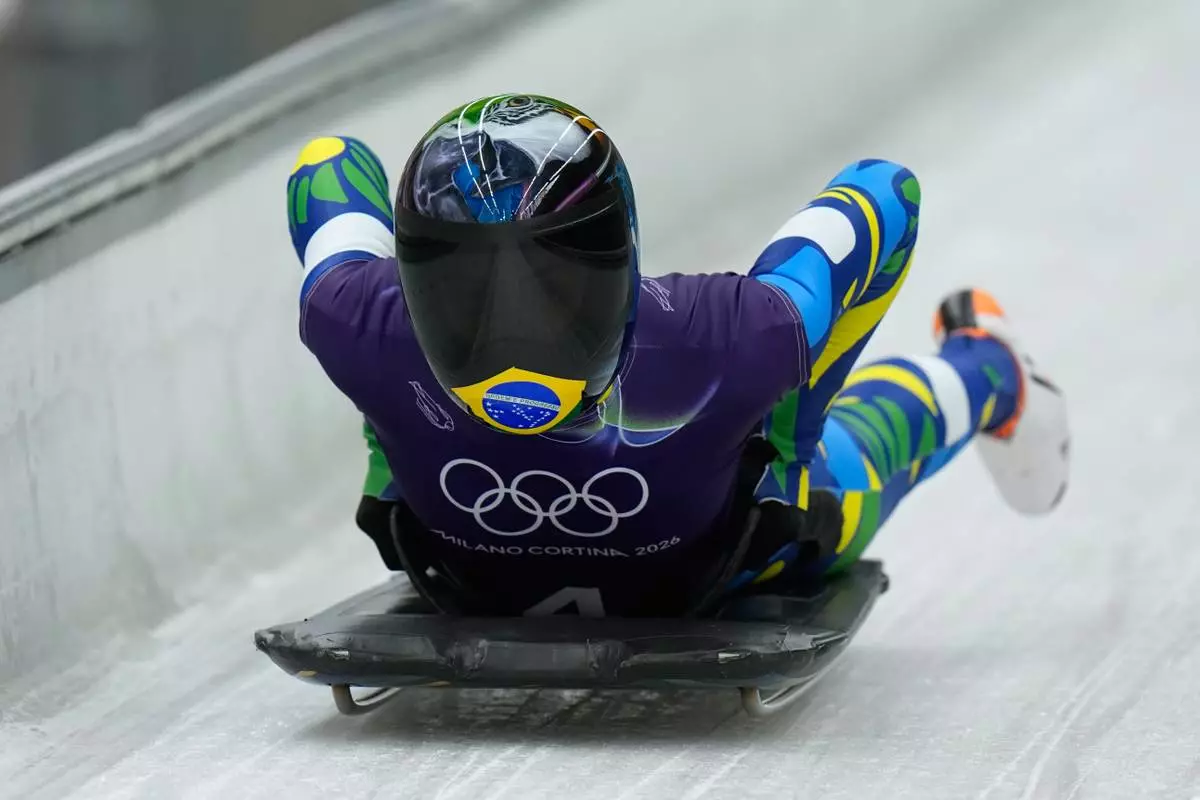 Brasil's Nicole Rocha Silveira arrives at the finish during a women's skeleton training session at the 2026 Winter Olympics, in Cortina d'Ampezzo, Italy, Tuesday, Feb. 10, 2026. (AP Photo/Alessandra Tarantino)