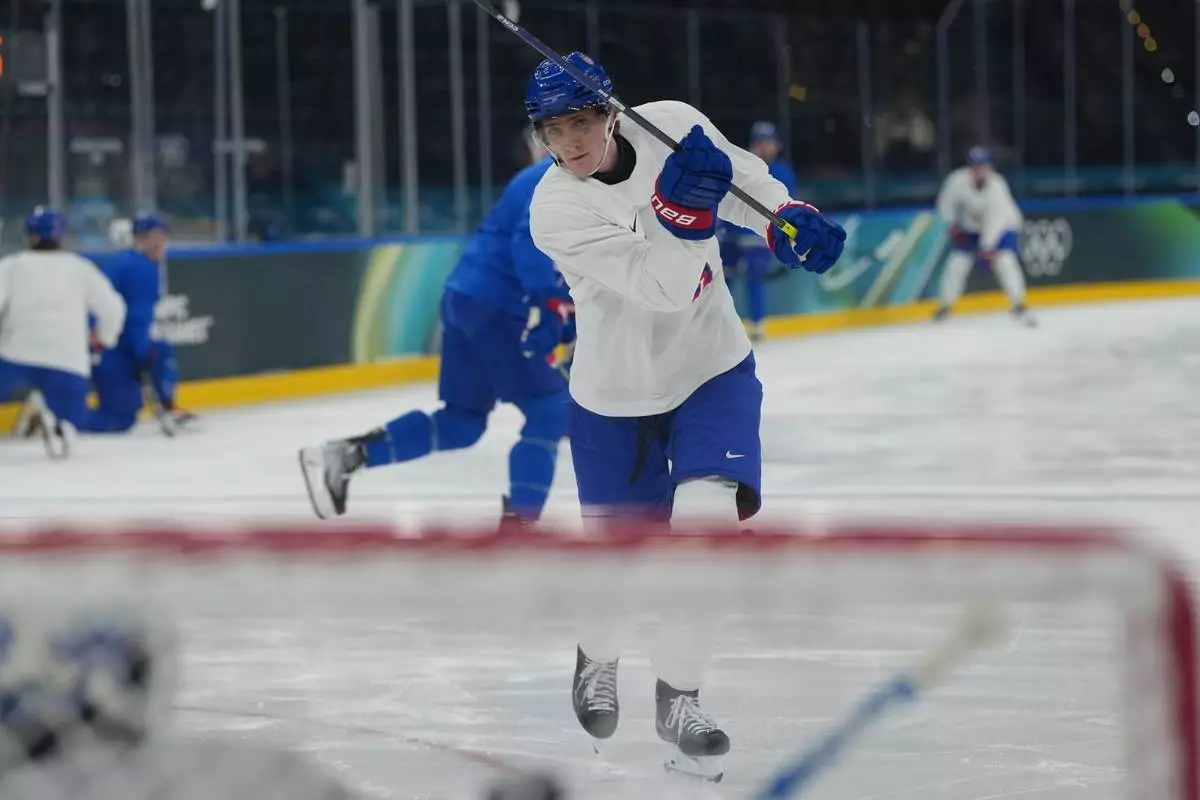 United States' Tage Thompson watches his shot during men's ice hockey practice at the 2026 Winter Olympics, in Milan, Italy, Sunday, Feb. 8, 2026. (AP Photo/Carolyn Kaster)