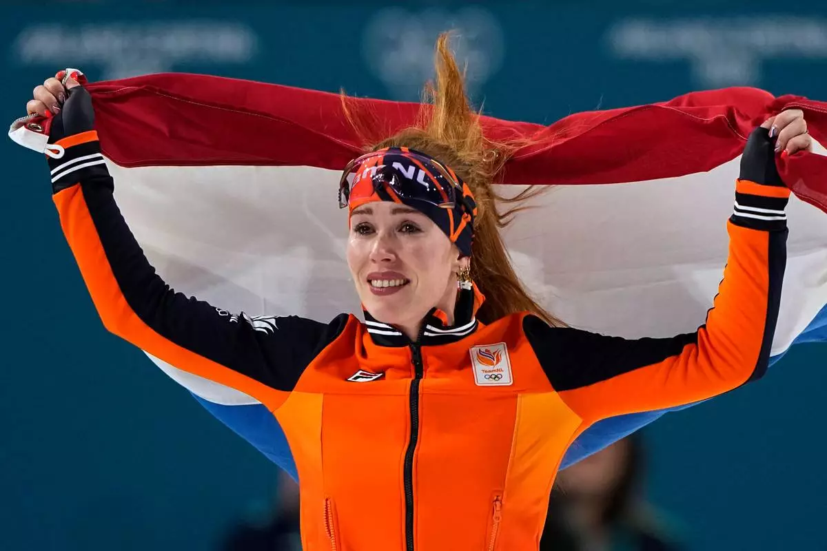 Antoinette Rijpma-de Jong of the Netherlands celebrates winning the gold medal on the women's 1500 meters speedskating race at the 2026 Winter Olympics, in Milan, Italy, Friday, Feb. 20, 2026. (AP Photo/Ben Curtis)