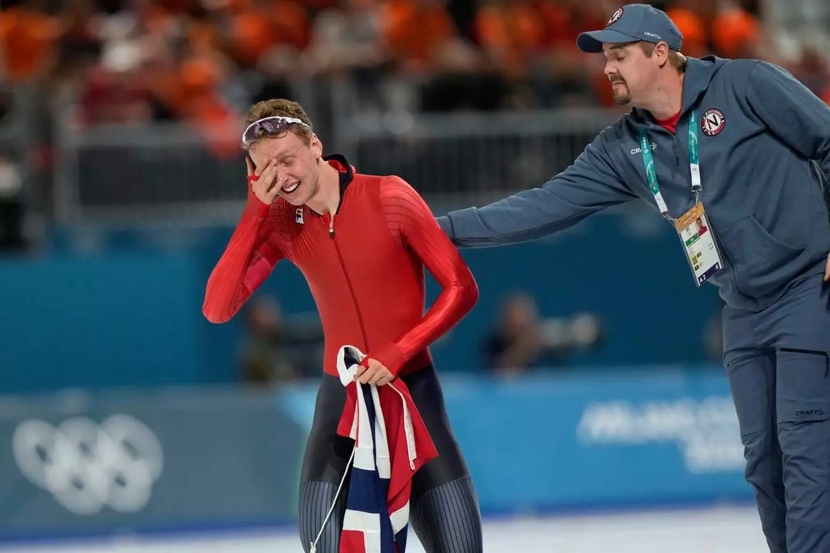 Sander Eitrem of Norway cries after winning a gold medal in the men's 5,000 meters speedskating race at the 2026 Winter Olympics, in Milan, Italy, Sunday, Feb. 8, 2026. (AP Photo/Luca Bruno)