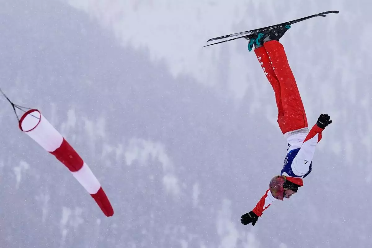 Switzerland's Pirmin Werner competes during the men's freestyle skiing aerials qualifications at the 2026 Winter Olympics, in Livigno, Italy, Friday, Feb. 20, 2026. (AP Photo/Abbie Parr)