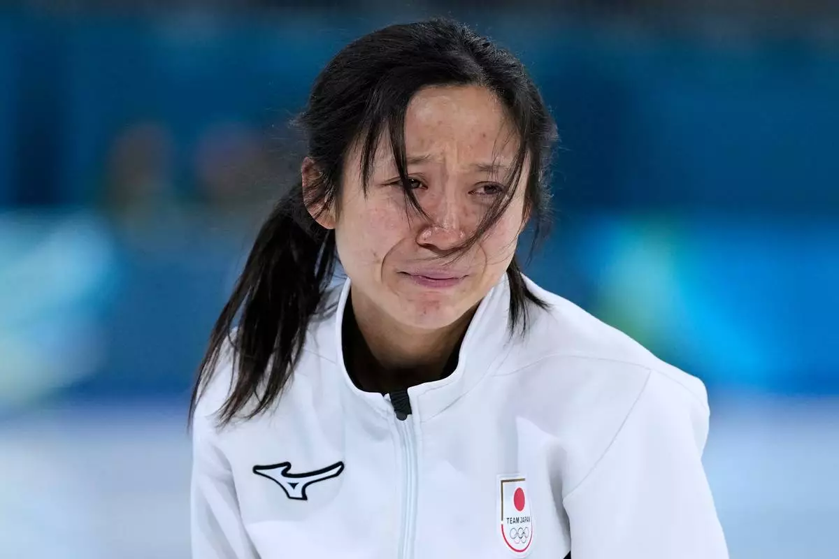 Sixth placed Miho Takagi of Japan cries after the women's 1500 meters speedskating race at the 2026 Winter Olympics, in Milan, Italy, Friday, Feb. 20, 2026. (AP Photo/Ben Curtis)