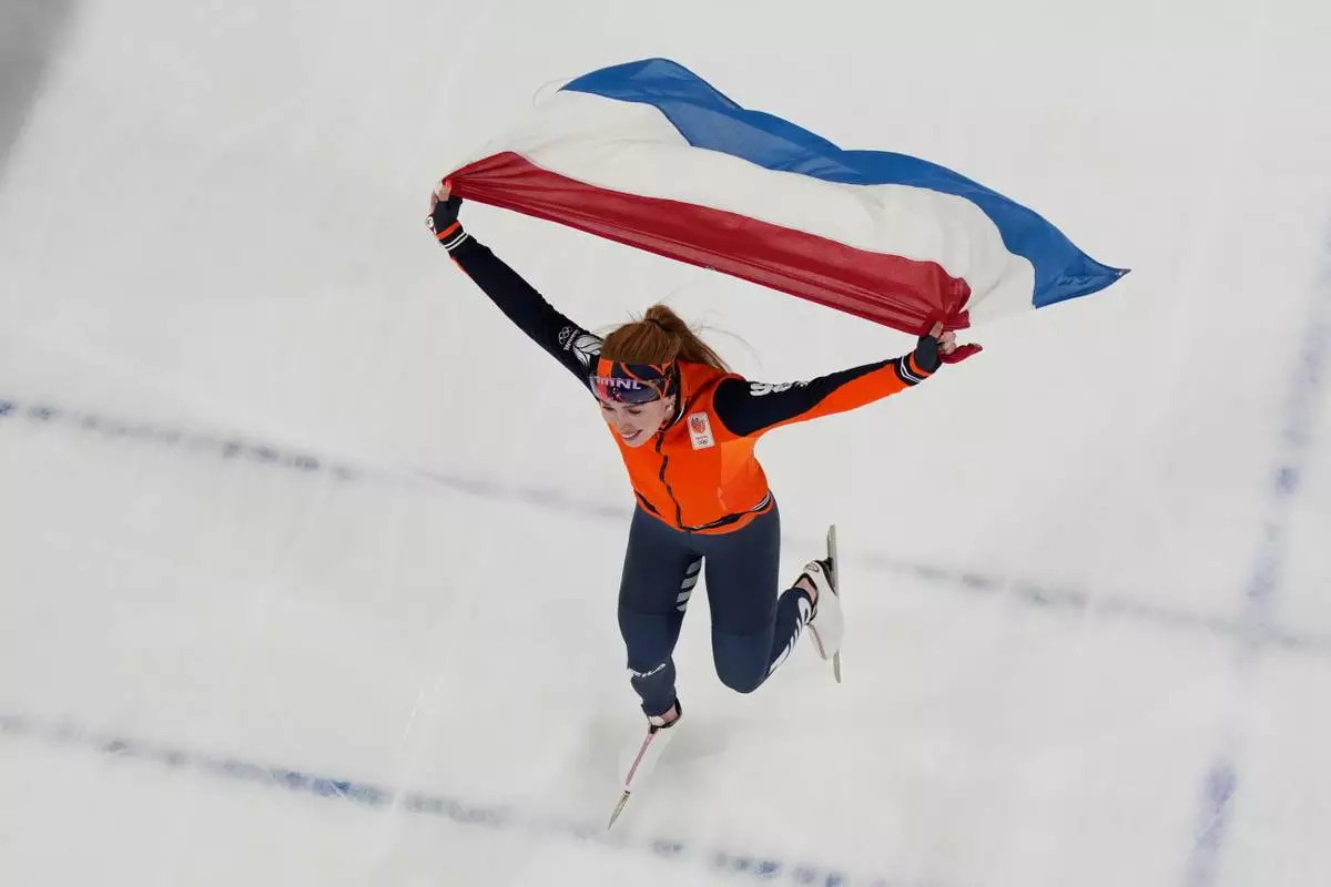 Netherlands' Antoinette Rijpma-de Jong celebrates after winning the women's speedskating 1,500-meters final at the 2026 Winter Olympics, in Milan, Italy, Friday, Feb. 20, 2026. (AP Photo/David J. Phillip)