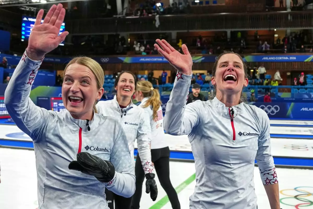 United States' Cory Thiesse, Tabitha Peterson, and Tara Peterson react after the women's curling round robin session against Switzerland, at the 2026 Winter Olympics, in Cortina d'Ampezzo, Italy, Thursday, Feb. 19, 2026. (AP Photo/Misper Apawu)