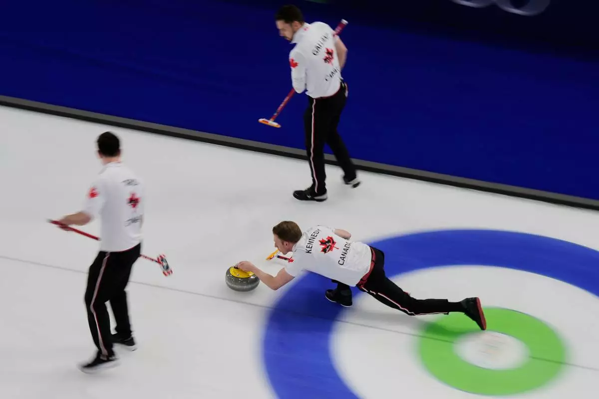 Canada's curling team compete during the men's curling round robin session against Norway at the 2026 Winter Olympics, in Cortina d'Ampezzo, Italy, Thursday, Feb. 19, 2026. (AP Photo/Bernat Armangue)
