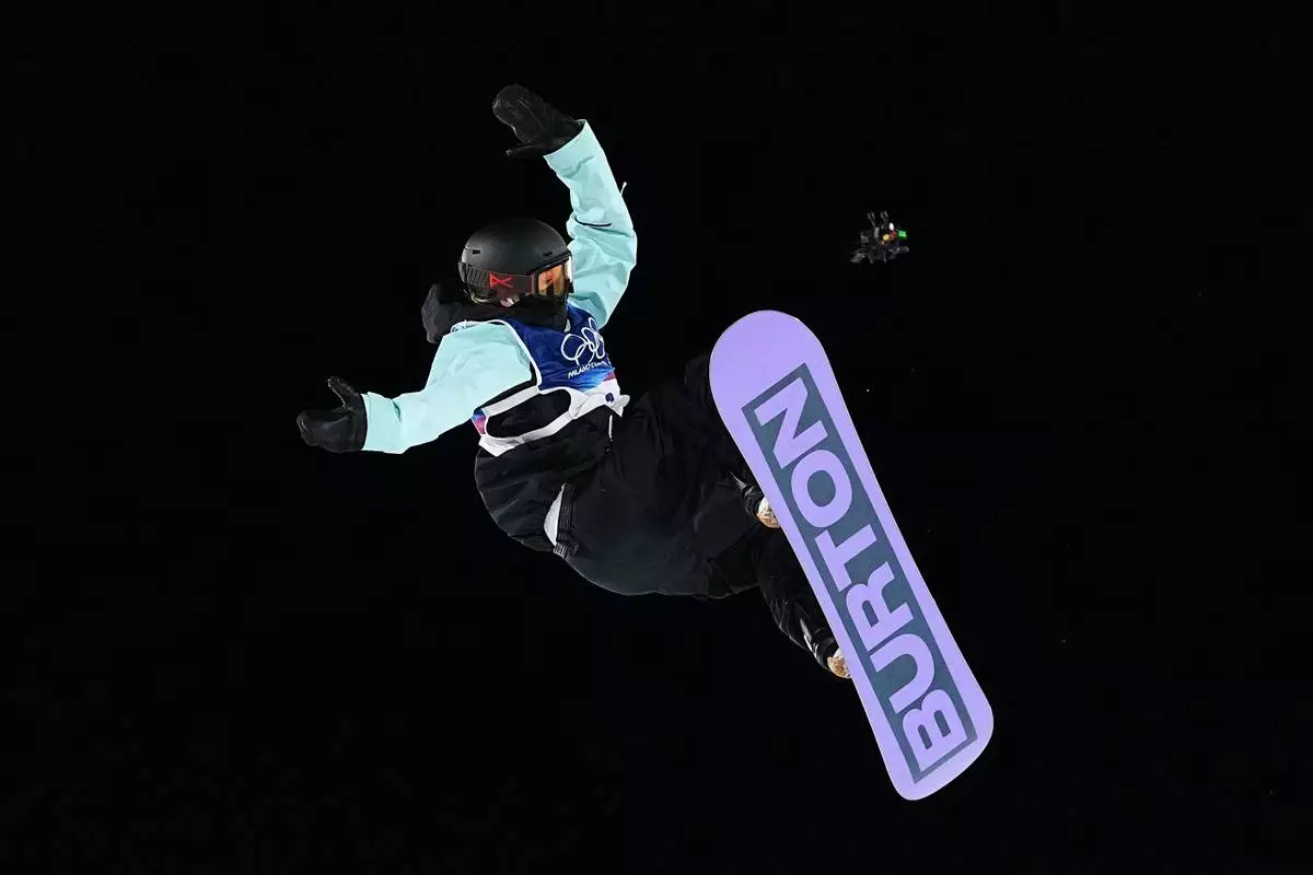 Austria's Hanna Karrer competes during the women's snowboarding big air finals at the 2026 Winter Olympics, in Livigno, Italy, Monday, Feb. 9, 2026. (AP Photo/Lindsey Wasson)