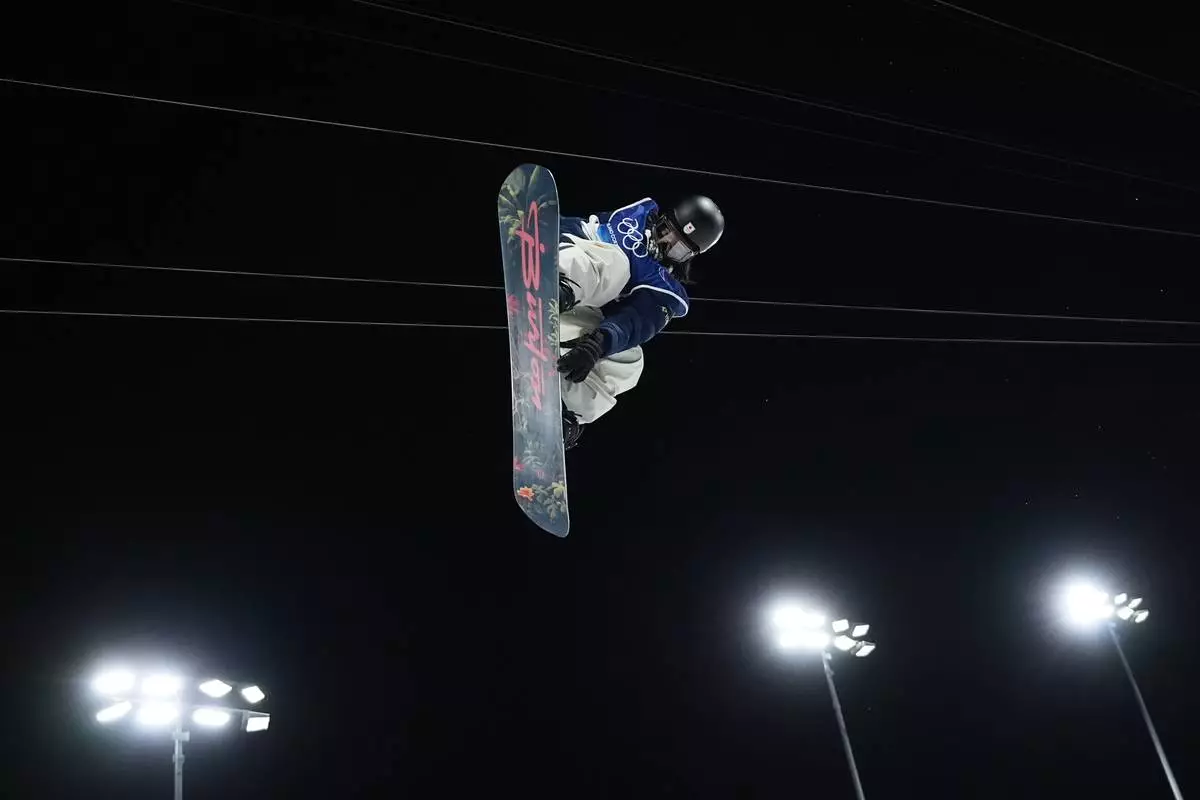 Japan's Ayumu Hirano practices before the men's snowboarding halfpipe finals at the 2026 Winter Olympics, in Livigno, Italy, Friday, Feb. 13, 2026. (AP Photo/Lindsey Wasson)