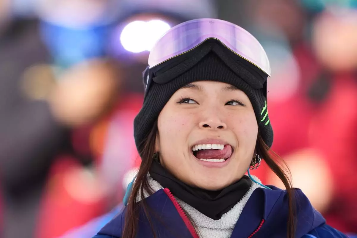 United States' Chloe Kim reacts to her score during the women's snowboarding halfpipe qualifications at the 2026 Winter Olympics, in Livigno, Italy, Wednesday, Feb. 11, 2026. (AP Photo/Lindsey Wasson)