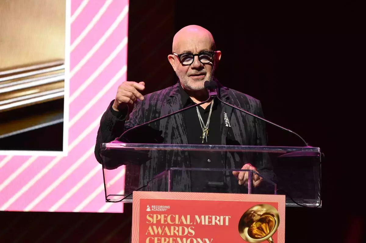 Bernie Taupin accepts the trustees award during the Recording Academy's Special Merit Awards on Saturday, Jan. 31, 2026, at the Wilshire Ebell Theatre in Los Angeles. (Photo by Richard Shotwell/Invision/AP)