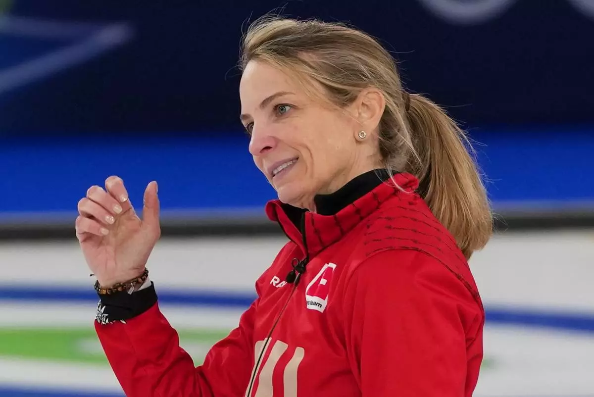 Switzerland's Silvana Tirinzoni reacts during a women's curling gold medal match between Switzerland and Sweden, at the 2026 Winter Olympics, in Cortina d'Ampezzo, Italy, Sunday, Feb. 22, 2026. (AP Photo/Misper Apawu)