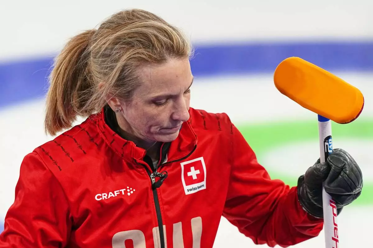 Switzerland's Silvana Tirinzoni reacts after a women's curling gold medal match between Switzerland and Sweden, at the 2026 Winter Olympics, in Cortina d'Ampezzo, Italy, Sunday, Feb. 22, 2026. (AP Photo/Fatima Shbair)