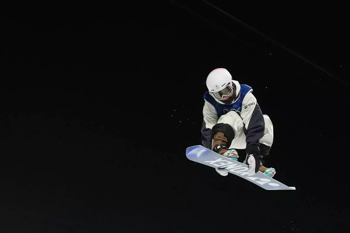 Japan's Yuto Totsuka competes during the men's snowboarding halfpipe finals at the 2026 Winter Olympics, in Livigno, Italy, Friday, Feb. 13, 2026. (AP Photo/Lindsey Wasson)