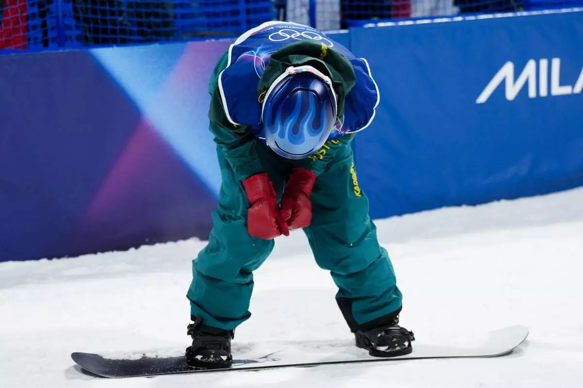 Australia's Scotty James reacts after falling on his last run to win the silver medal during the men's snowboarding halfpipe finals at the 2026 Winter Olympics, in Livigno, Italy, Friday, Feb. 13, 2026. (AP Photo/Abbie Parr)